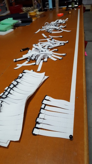 Cutting elastics for medical face shields